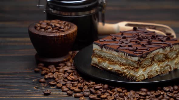 Portion of Traditional Italian Tiramisu Dessert and Coffee Beans