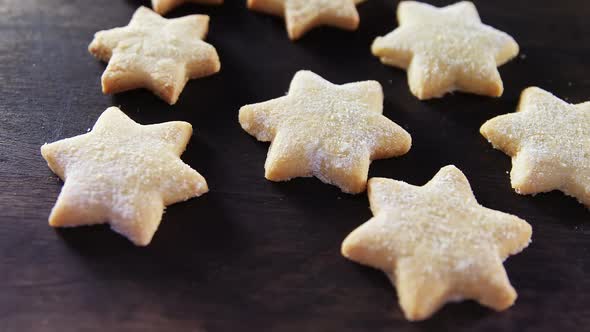 Gingerbread cookies with powdered sugar sprinkled on top 4k