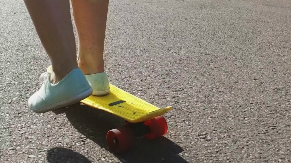 Teenage Girl Feet Riding Short Modern Skateboard