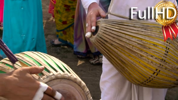 Krishna Festival. Musicians Play Drums. Women in
