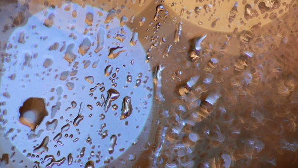 Colorful, Blurred, Bokeh Lights Background. Abstract Sparkles, Rain Drops On Window.