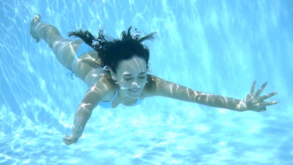 Happy Young Woman Smiling Underwater