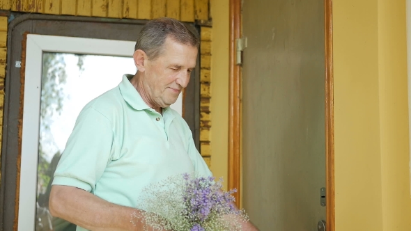 Man Surprises His Wife a Bouquet Of Flowers.