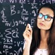 Beautiful Brunette Woman Posing Over School Board With Math Formulas. - VideoHive Item for Sale