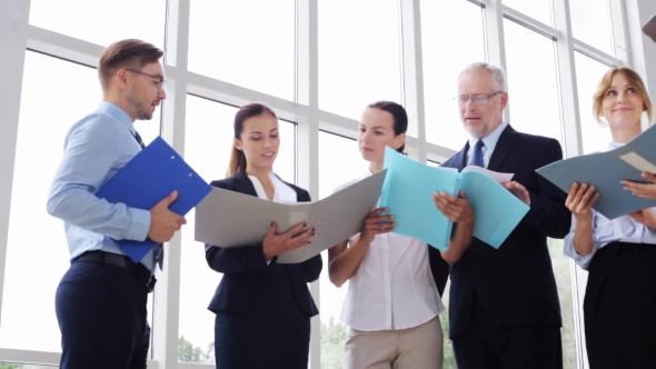 Business Team With Folders Meeting At Office 25