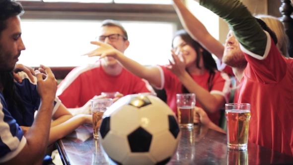 Soccer Fans Watching Football Match At Bar Or Pub 38