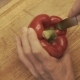 Male Hands Preparing Paprika On a Wooden Cooking Board - VideoHive Item for Sale