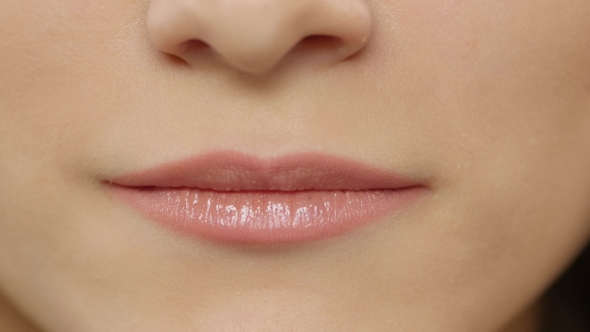 Female Lips. Girl Showing Braces On Teeth. White. 