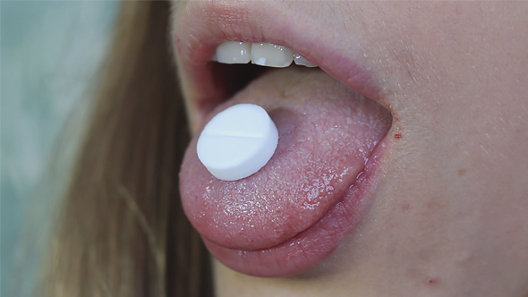 Woman Swallows Drug Pill