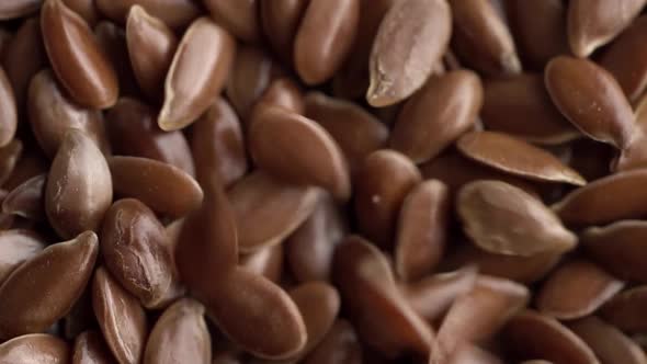 Flax seeds pouring.