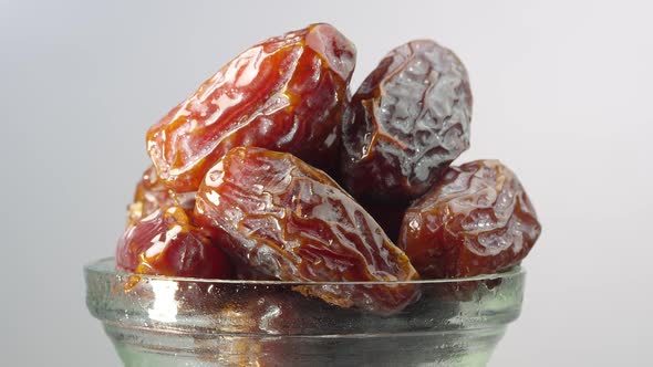 Dates in a glass dish rotating