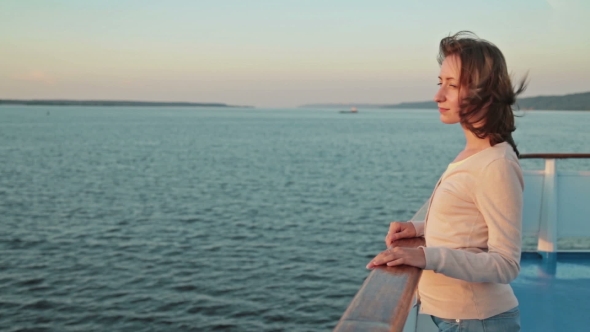 Young Pretty Woman On Cruise Ship At Sunset.