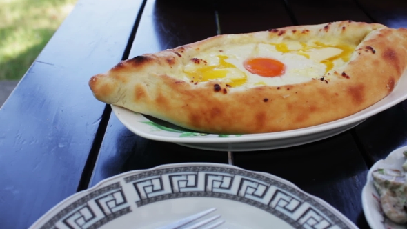 Adjarian Khachapuri Georgian Cuisine In The Restaurant. Georgian Food