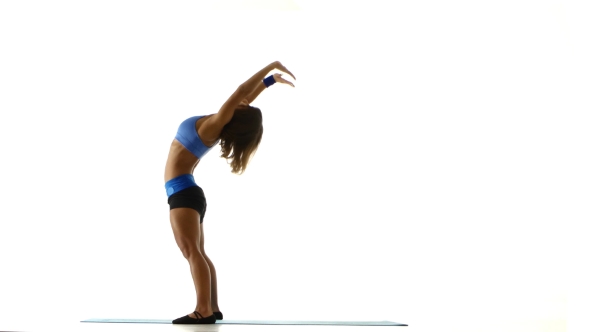 Gymnast Doing Bridge On The Floor. White