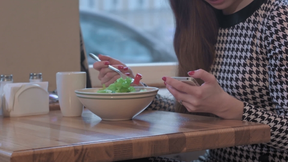 Arms Of Young Businesswoman Using a Smartphone For Communication