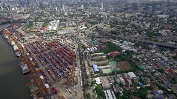 Logistic concept aerial shot of commercial maritime transport dockyard with cargo ships waiting to b