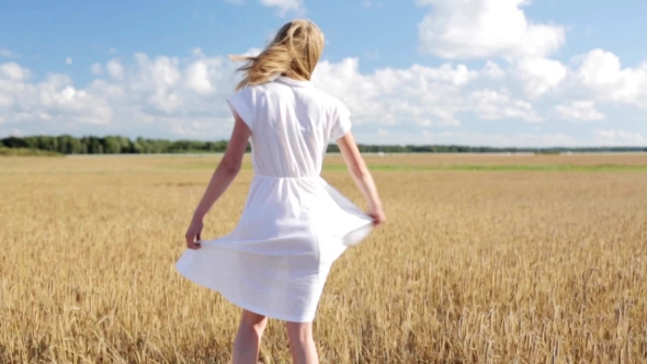 Smiling Young Woman In White Dress On Cereal Field 50