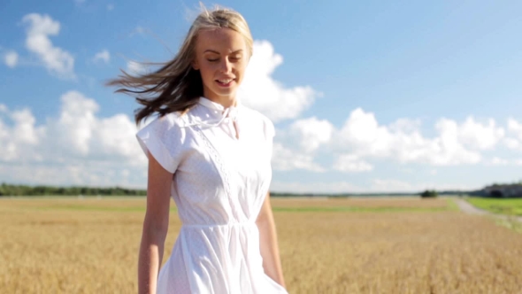 Smiling Young Woman In White Dress On Cereal Field 53