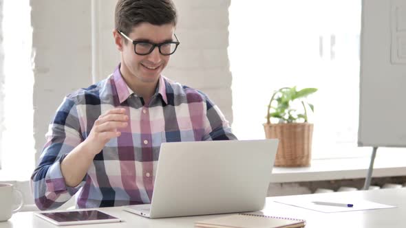 Online Video Chat By Young Man on Laptop