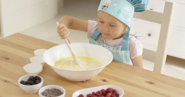 Adorable Toddler At Mixing Bowl