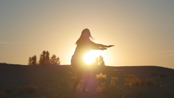 Silhouette Of a Girl Professional Dancer Jumping At Sunset In 