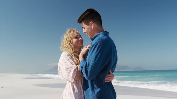 Couple in love enjoying free time on the beach together