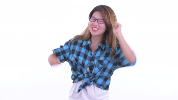Happy Young Asian Hipster Woman Dancing
