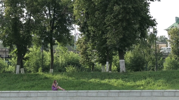 Girl At The Park Writes In Her Personal Diary