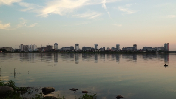 Sunset At The Reservoir Near The City