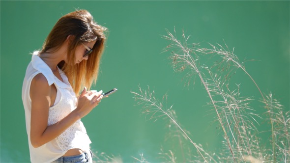 Girl Texting on Mobile Phone