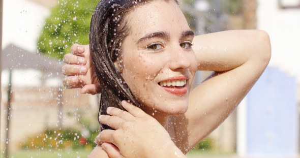 Beauty Smiles At Camera While Standing In Shower