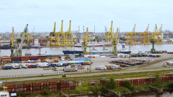 timelapse of a seaport with cranes, ships, containers and cargo in Saint-Petersburg, Russia