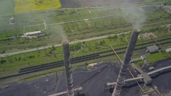 Chimneys of a Thermal Power Plant. Shooting From the Height of an Energy Object Running on Fossil