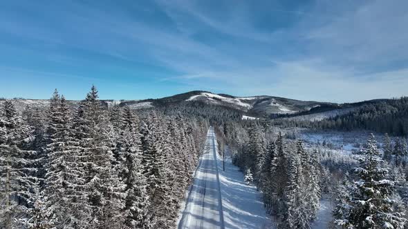 Aerial view of a snowy road in the High Tatras National Park in Slovakia