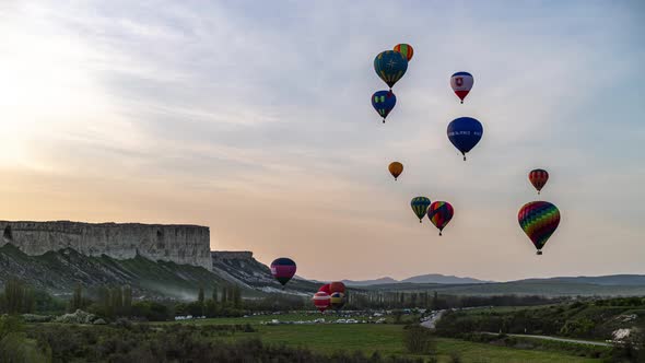 Beautiful Rocky Landscape of Crimea with Colorful Hotair Balloons Balloons Flying on Sunset HDR Time