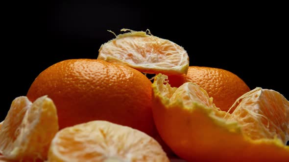 The Bunch with Peeled and Unpeeled Tangerines in Rotation