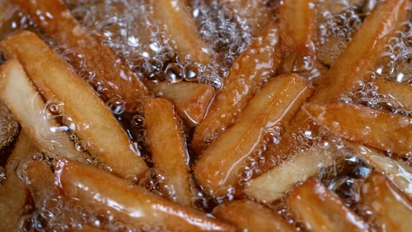 Super Slow Motion Shot of Frying Fresh French Fries at 1000Fps