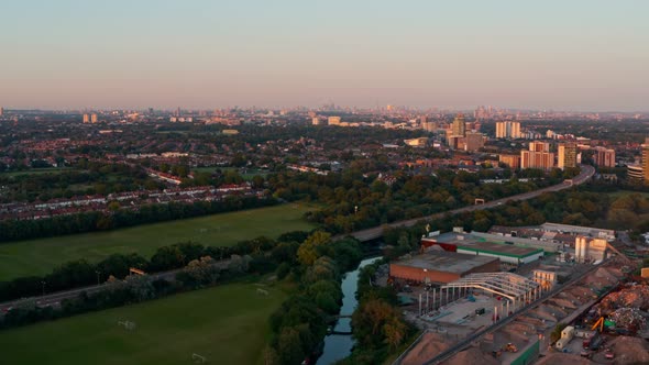 Dolly forward drone shot towards Central London skyline from the West at sunset
