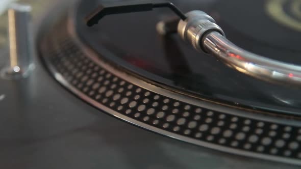 Professional dj turn table player plays vinyl disc with music