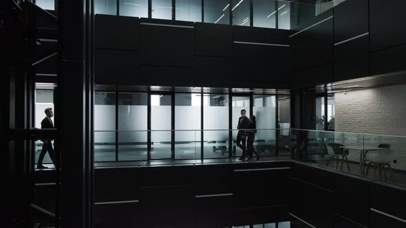 Silhouette of an Young Business People That are Walking Inside the Building