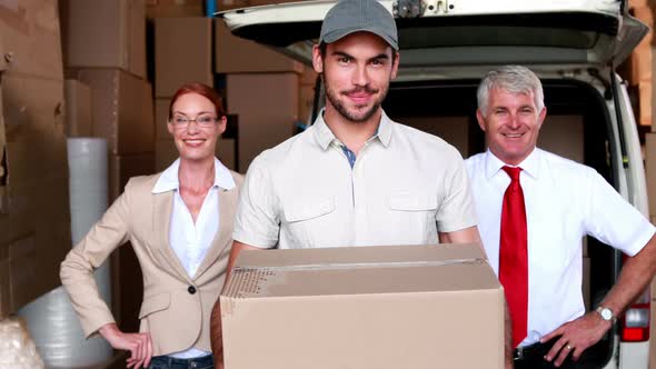 Delivery Driver and Business Team Smiling at Camera