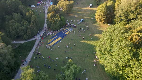 Aerial View of People Looking at How Hot Air Balloons Prepare for an Summer Evening Flying in Park