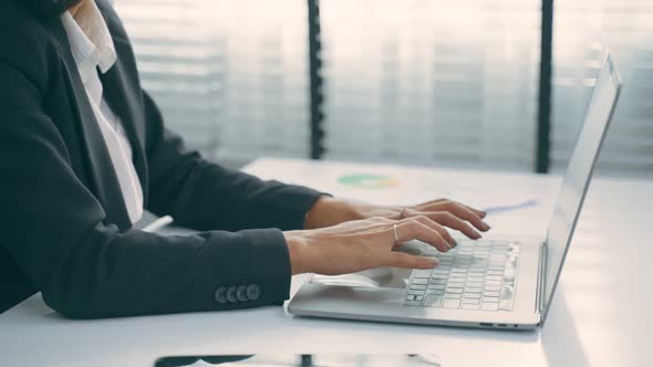 Latino beautiful business woman call center smile and typing laptop while work in office.