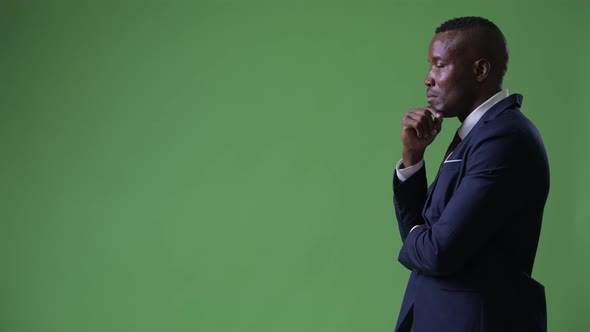 Profile View of Young African Businessman Thinking