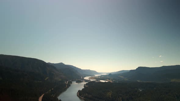 Bird'seye View of the Sunrise Over the River with Hilly Terrain