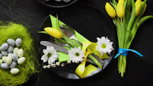 Easter Spring Table Dishware Composition with Yellow Tulip Flower