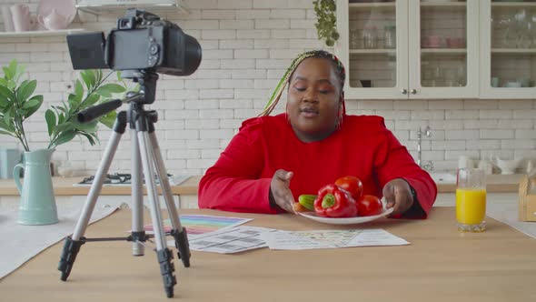 Black Female Food Blogger Recording Vlog in Kitchen