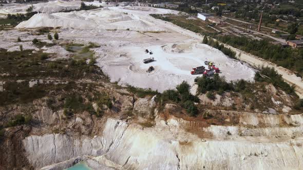 Aerial view trucks near quarry extraction porcelain clay, kaolin