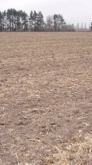 Vertical Video of a Field with Plowed Land in Autumn Slow Motion