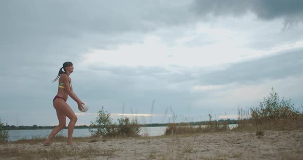 Energy and Power of Sportswoman at Volleyball Match on Beach, Slow Motion Shot, Female Player Is